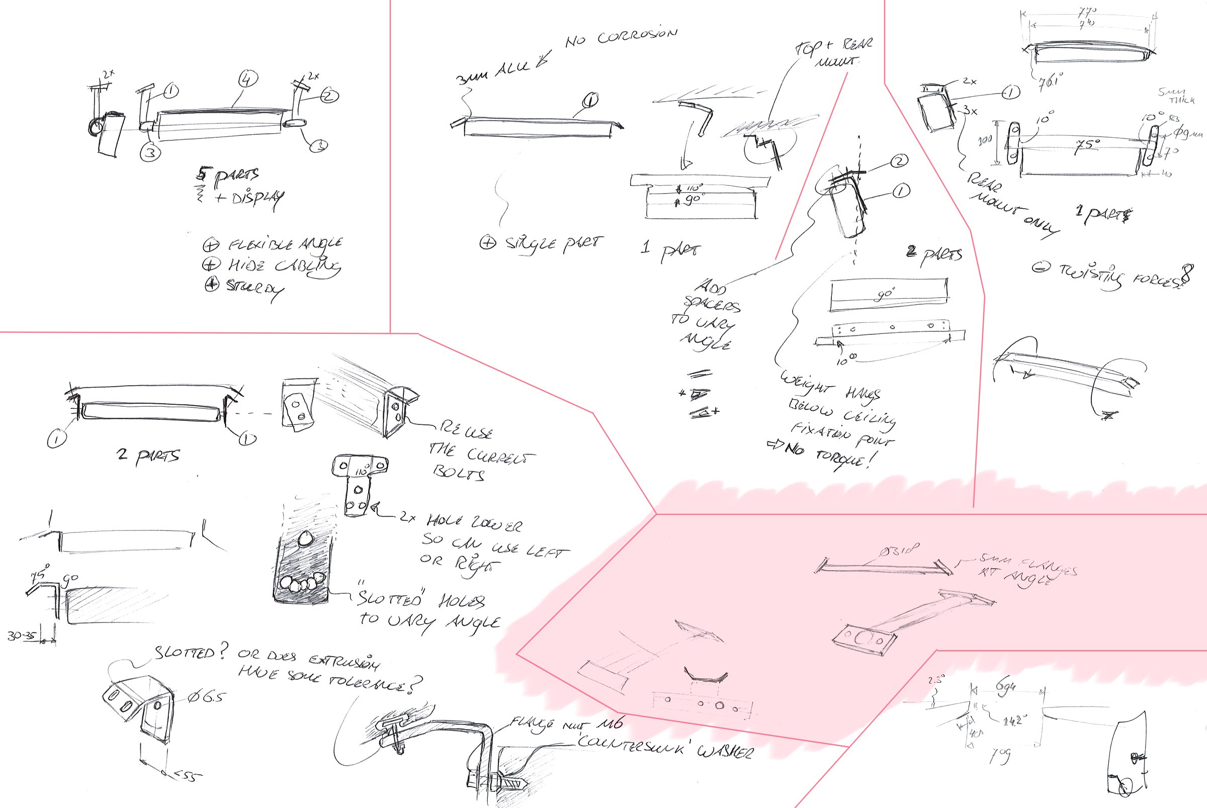 handdrawn sketches showing several ideas being explored, with one idea marked in light pink